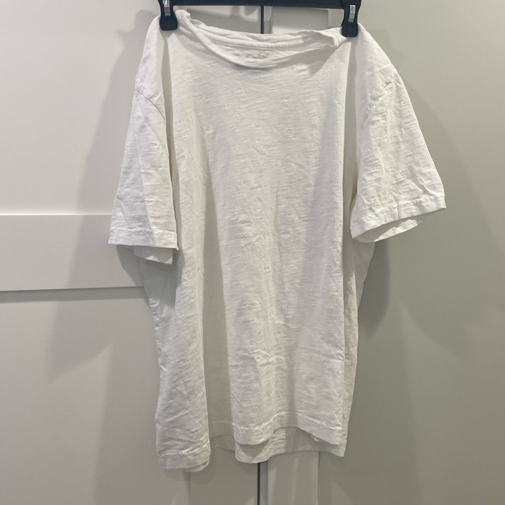 The brand is 1901 and it is a size large. It’s a plain white t-shirt.